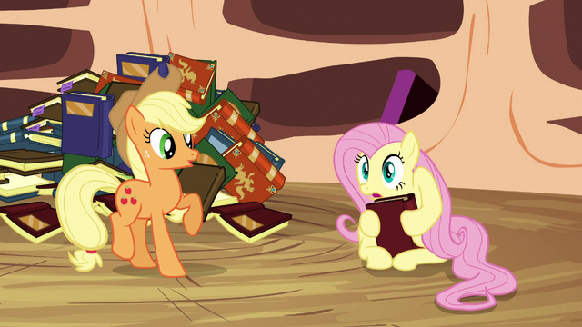 File:Fluttershy holds a book with her hooves S3E05.png