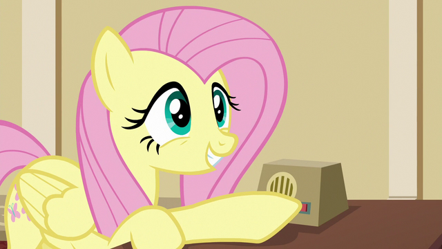 File:Fluttershy holding Gladmane's loudspeaker button S6E20.png