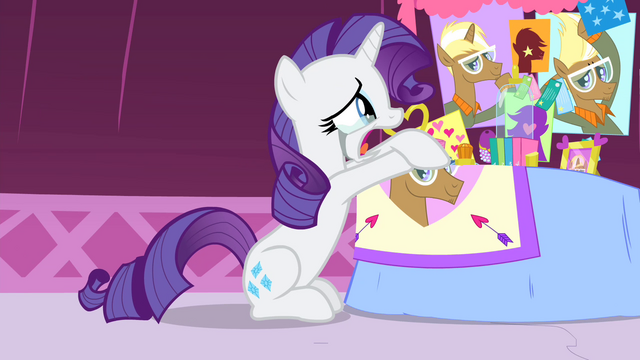 File:Rarity crying while looking at photos of Trenderhoof S4E13.png