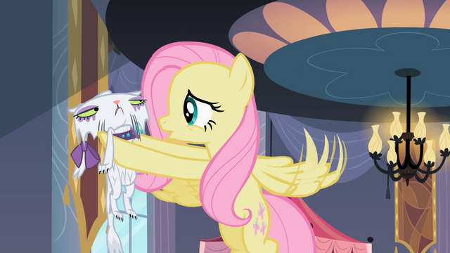 File:Fluttershy holding Opalescence S2E9.png
