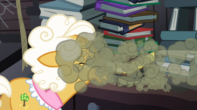 File:Goldie blowing the dusty cat S4E09.png