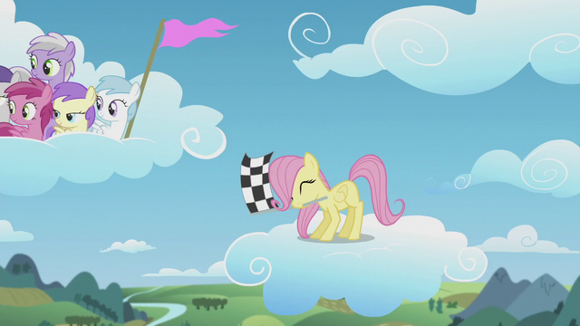 File:Filly Fluttershy waves the checkered flag S5E25.png