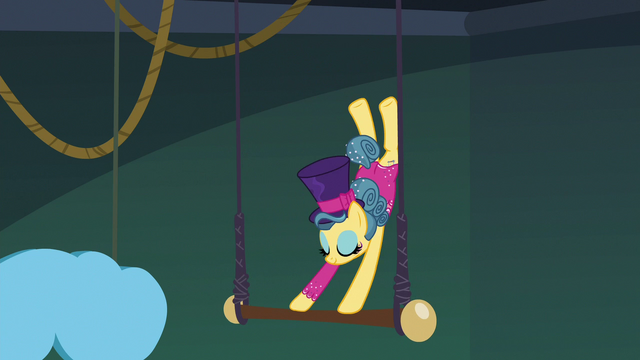 File:Trapeze star flipping on the trapeze bar again S6E20.png