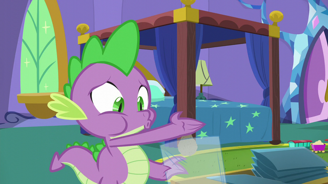 File:Spike puts comic book ashes into plastic S5E19.png