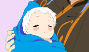 Gus holding his oldest child, Demyx