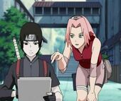 Sakura watches Sai draw