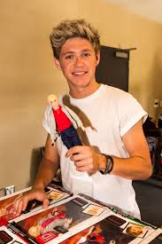 File:Niall is holding a doll.jpg