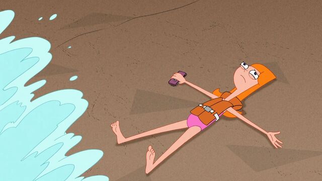 File:Candace lying on the sand with a wave about to go over her.jpg