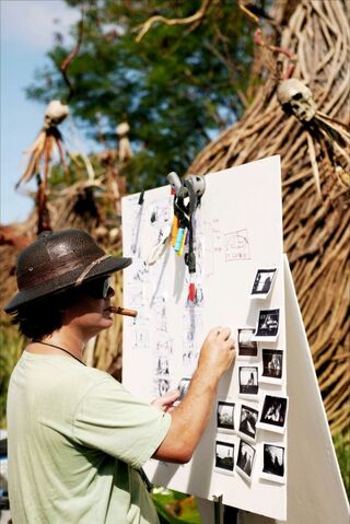 File:GoreStoryboardsOnSet.jpg