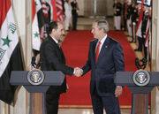 Bush al-Maliki handshake