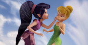 Vidia pinching Tink's cheeks