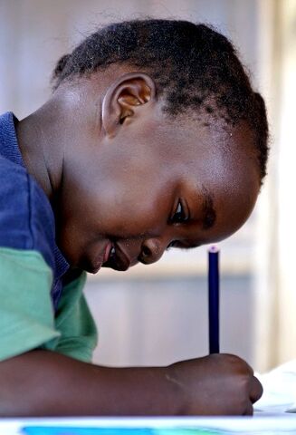 File:Child with pencil.jpg