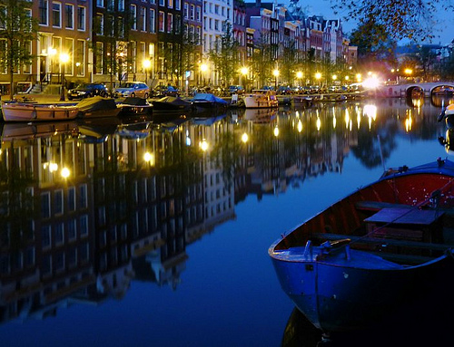 Blue canal at night in Amsterdam