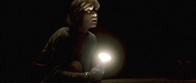 File:Turns on the flashlight.jpg
