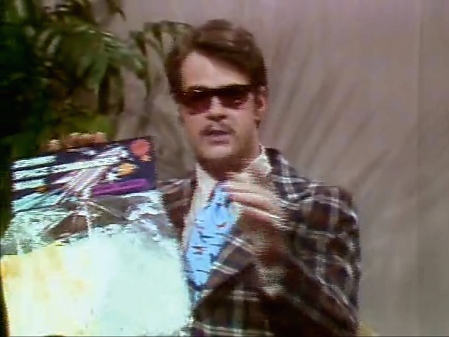 File:Dan Aykroyd (1970s Review).png