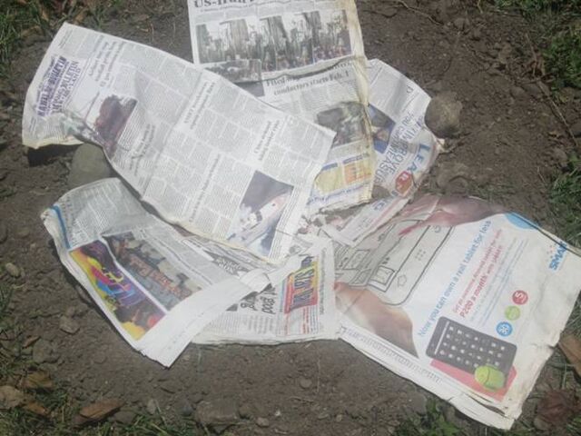 File:Cover with newspaper.jpg