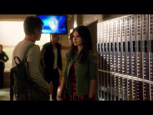 Emery and Roman in hallway