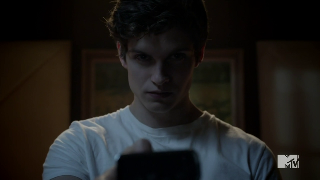 File:Teen Wolf Season 2 Episode 6 Motel California Daniel Sharman Isaac watches static .png