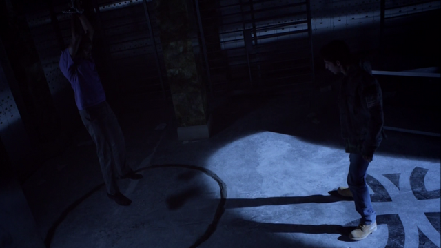 File:Teen Wolf Season 3 Episode 7 Currents Seth Gilliam Tyler Posey Scott faces mountain ash around deaton.png