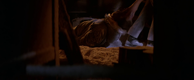File:An assimilated Garry is dragged away -The Thing (1982).png