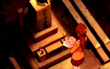 Sayo Visiting Her Parents' Grave