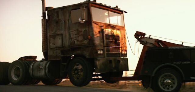 File:Cade Tows Optimus.jpg