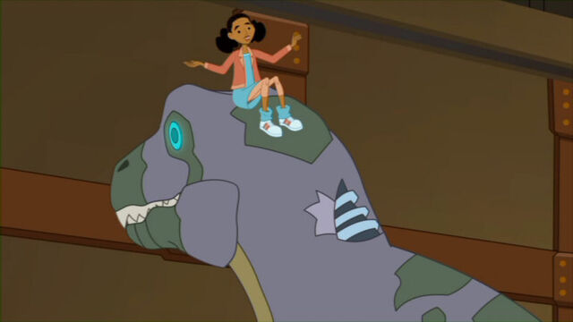 File:ReturnDinoBot Frankie sits on Trex.jpg