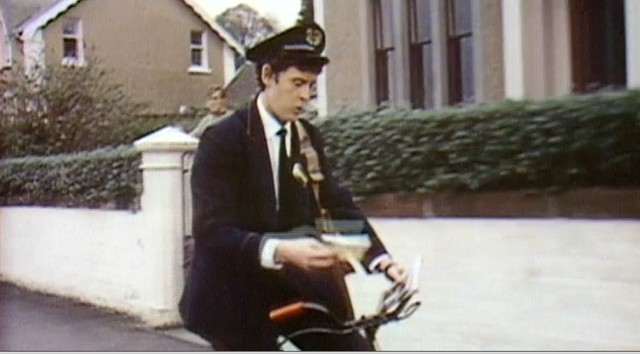 File:Postman riding by.png
