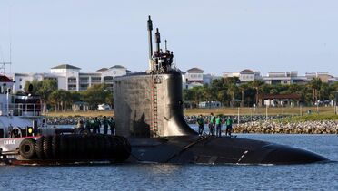 US Navy 060825-N-7441H-004 The Virginia-class attack submarine USS Texas (SSN 775) is guided into port by local tugboats near Port Canaveral-1-.jpg