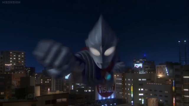 File:Tiga flies and punches.png