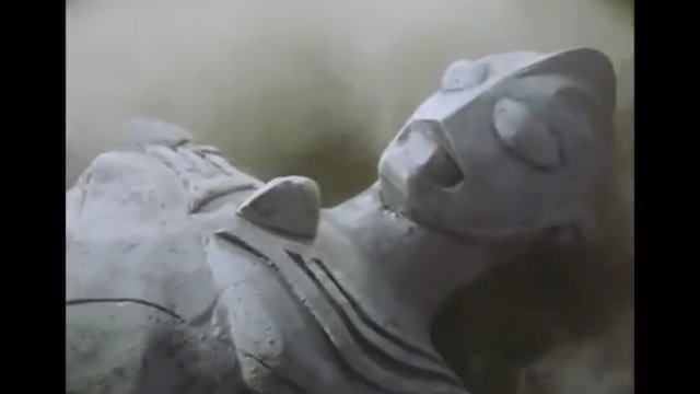 File:Tiga's statues pushed down.png
