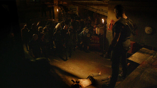 File:Stay Inside 1x03 Julius in his compund as Gustov delivers news.jpg