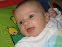 Baby-girl-5-five-weeks-old-on-playmat-play-gym-closeup-1-JR