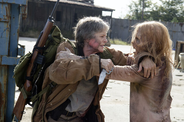 File:CarolKillingZombie.jpg