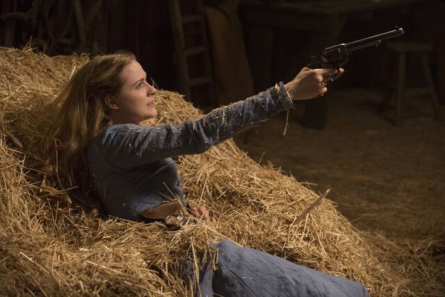 File:Dolores holding the gun.jpg