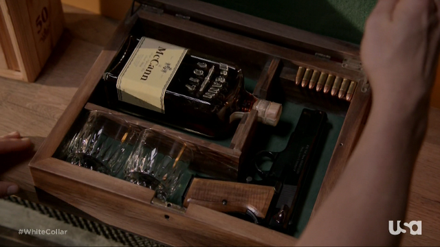 File:4x11-FlynnJrGunBox.png