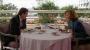 Tom Colton and Dana Scully at table