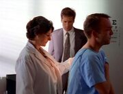 Zenzola and Fox Mulder with sanitation worker