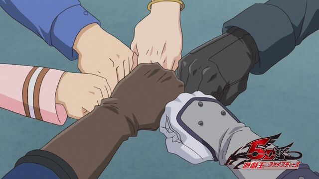 File:5Dx154 Group fistbump.jpg