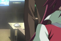 Aki eyes her mask