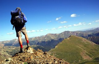 Hiker-backpacker-with-heavy-load-backpack-gear